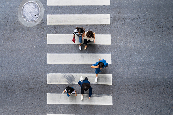 People walking Overhead Crosswalk